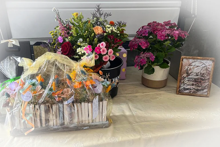 Flowers and carefully wrapped gifts to celebrate the inauguration of the poultry house