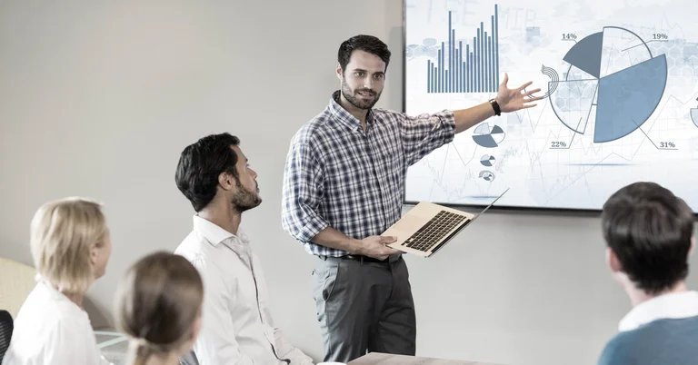Businessman giving presentation to his colleagues