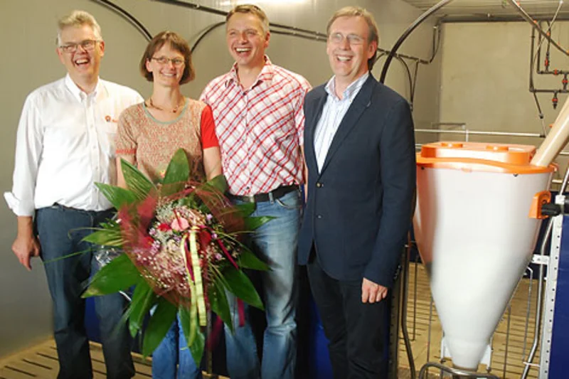 Much sought-after pig feeders:  Flowers and congratulations on the 1.5 millionth feeding place