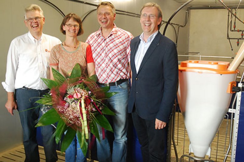 Much sought-after pig feeders:  Flowers and congratulations on the 1.5 millionth feeding place