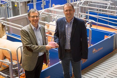 Magnus Westerkamp and Björn Markus in the Big Dutchman exhibition hall