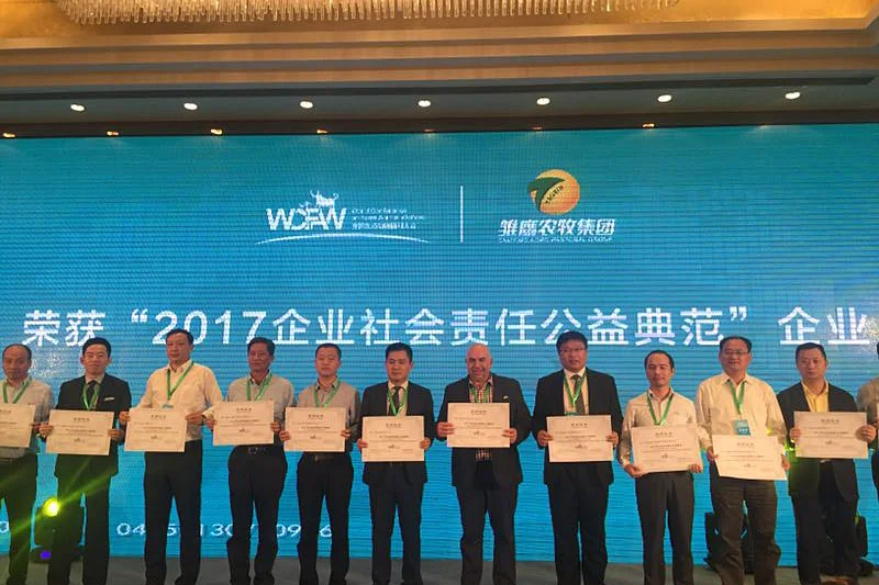 Holding the certificates up to the camera 