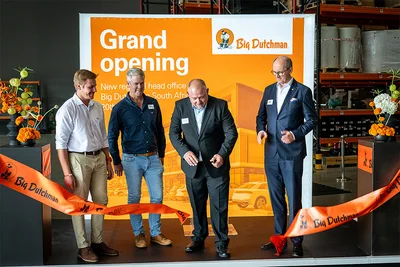 Four men at a ribbon-cutting ceremony